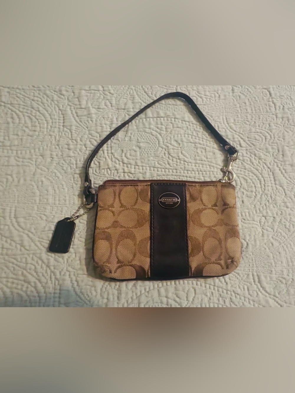 Coach Signature tan/brown canvas wristlet, w/strap, good/used.